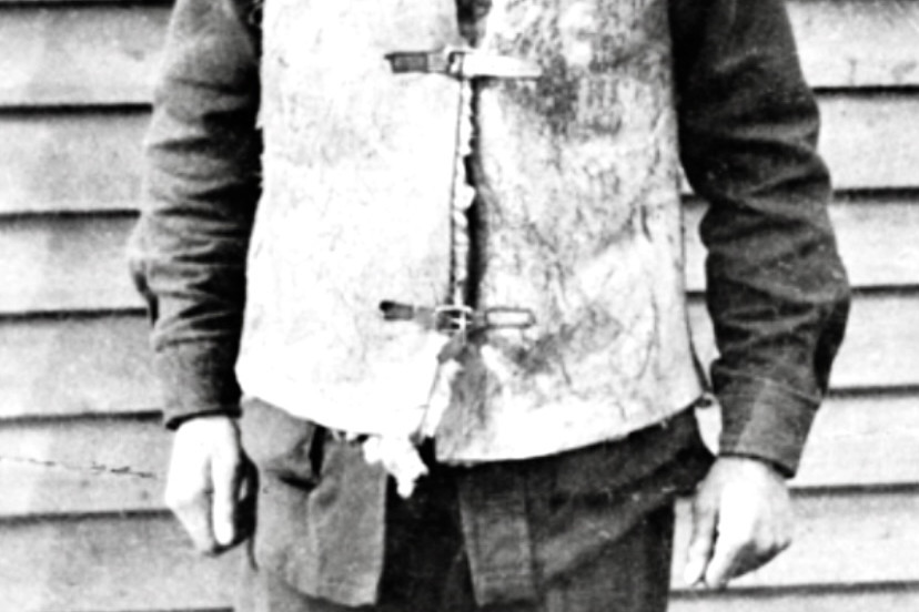 WEST WYALONG SOLDIER: Informal portrait of Private Reginald Baden Crowley of West Wyalong, NSW. He is wearing a sheepskin jerkin over his uniform and smoking a cigarette. Photo: Australian War Memorial.