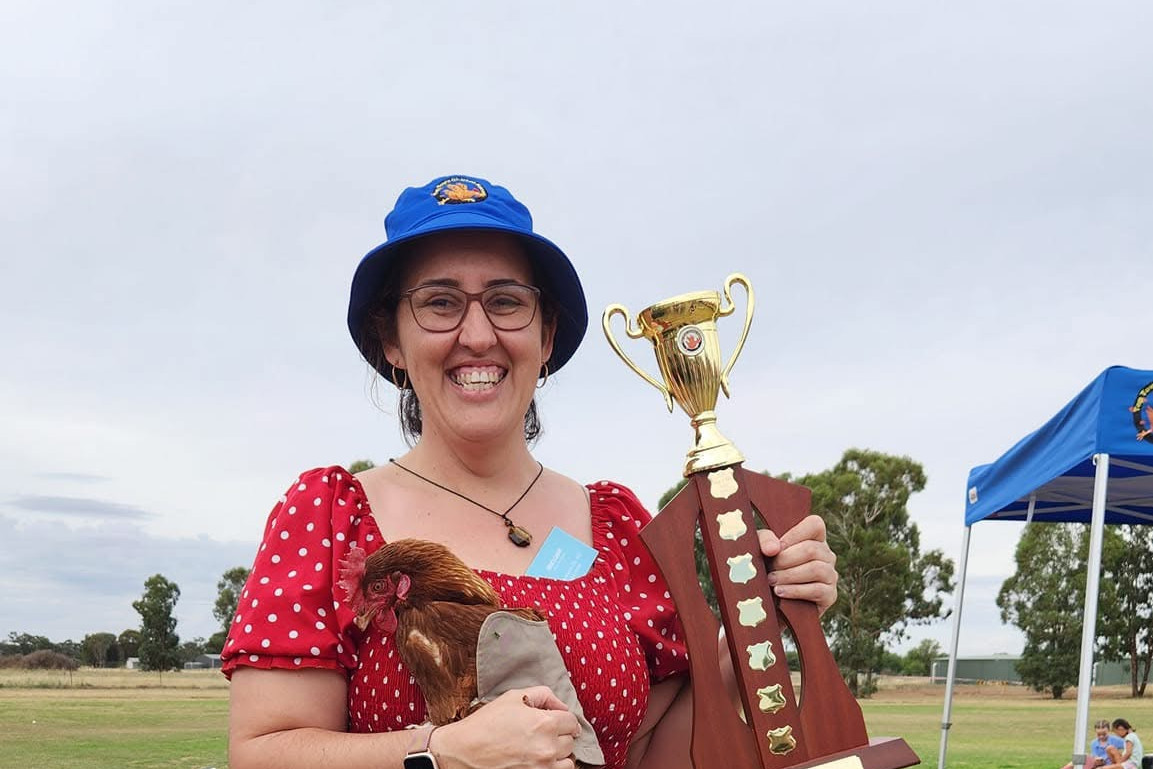 WINNER WINNER CHICKEN DINNER: Barb Last with Lil' Pecker after last year's win in the TTT Chicken Races. Photo supplied.