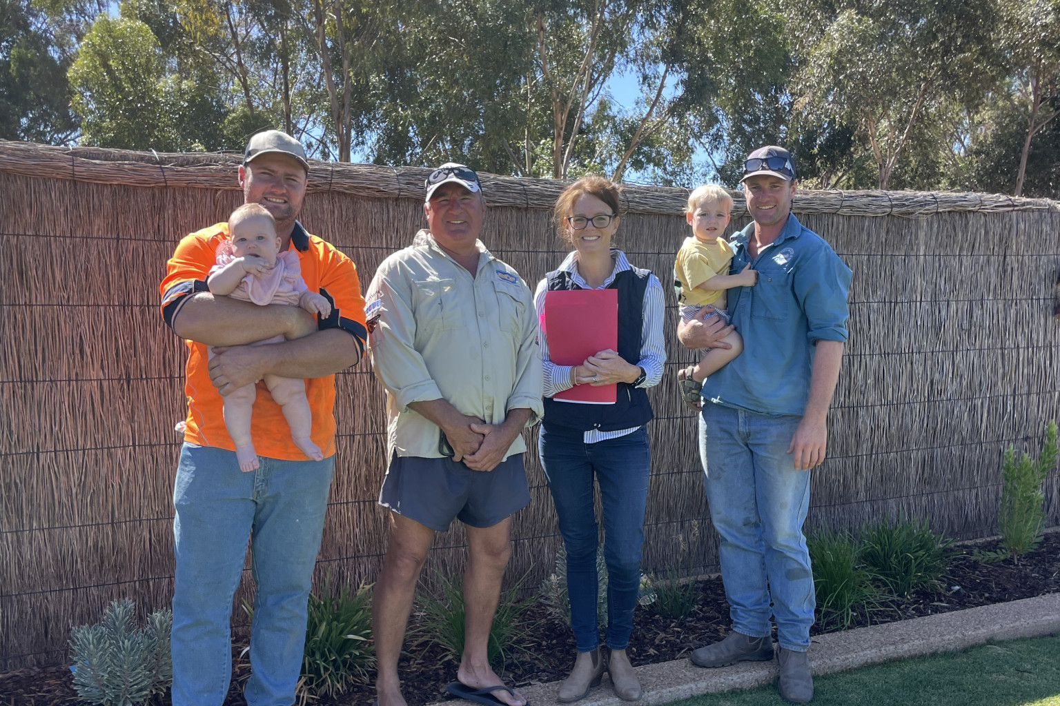 FIGHT FOR FAMILY FARMS: Steph Cooke, with Lenny, Bailey and Logan Lynch and children. Photo supplied.